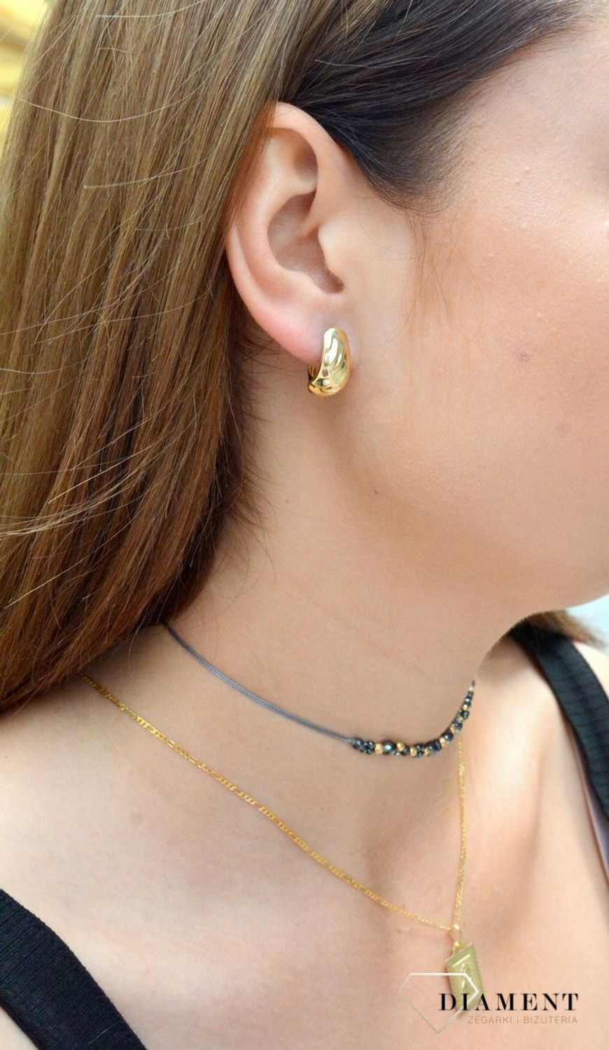 Złote kolczyki pr 333 blaszki nacinane KL 4394A 333. Złote kolczyki wykonane z dbałością o każdy szczegół i detal. Kolczyki zachowane w prostej formie blaszki. Elegancka biżuteria posiada wygodne zapięcie t.jpg